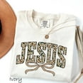 thumbnail image 1 of "Christian 'JESUS' Camo T-Shirt – Rustic Faith Graphic Tee with Bow Design for Outdoor and Everyday Wear", 1 of 6