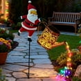 thumbnail image 1 of Christmas Santa Solar Kettle Lights Garden Lawn Decorative Lights, Hanging Metal Solar Santa Claus Watering Can with LED Light, Waterproof Outdoor Lantern Decoration for Yard Patio, 1 of 7