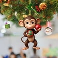 thumbnail image 1 of Christmas Tree Pendant - Monkey Holding Ornament - Unique Acrylic Decoration for Book Stacking and Yearly Celebrations, 1 of 4