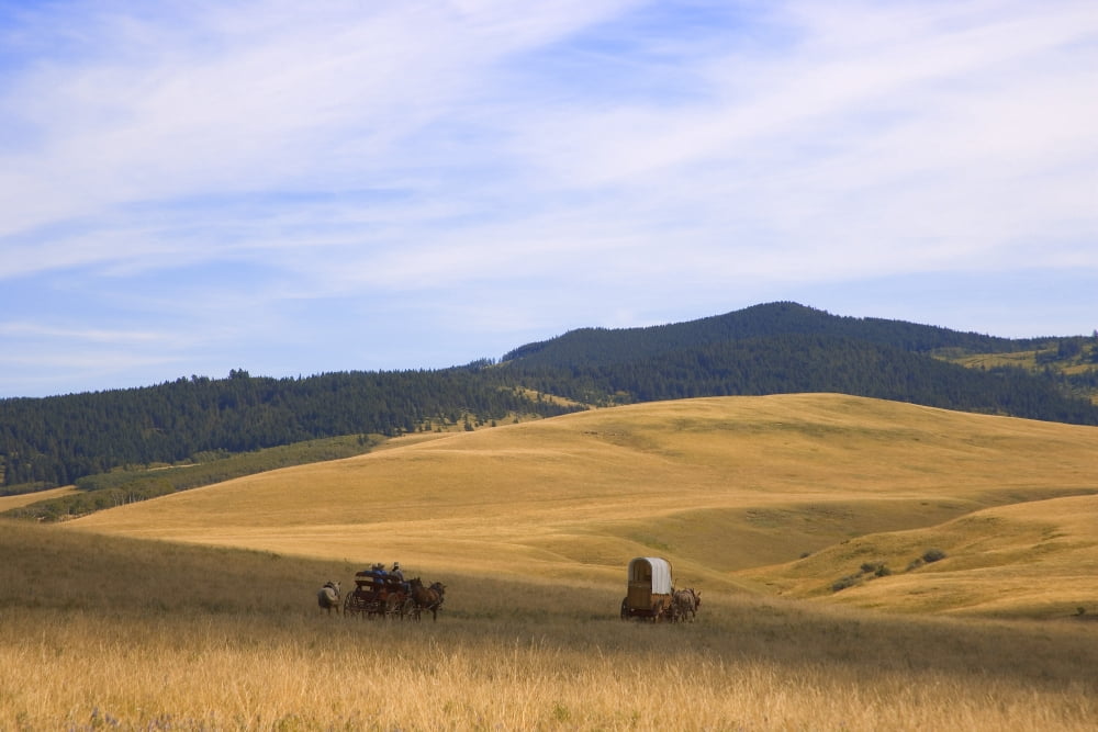 Chuck Wagons Crossing The Prairies Canvas Art - Carson Ganci Design Pics (17 x 11)