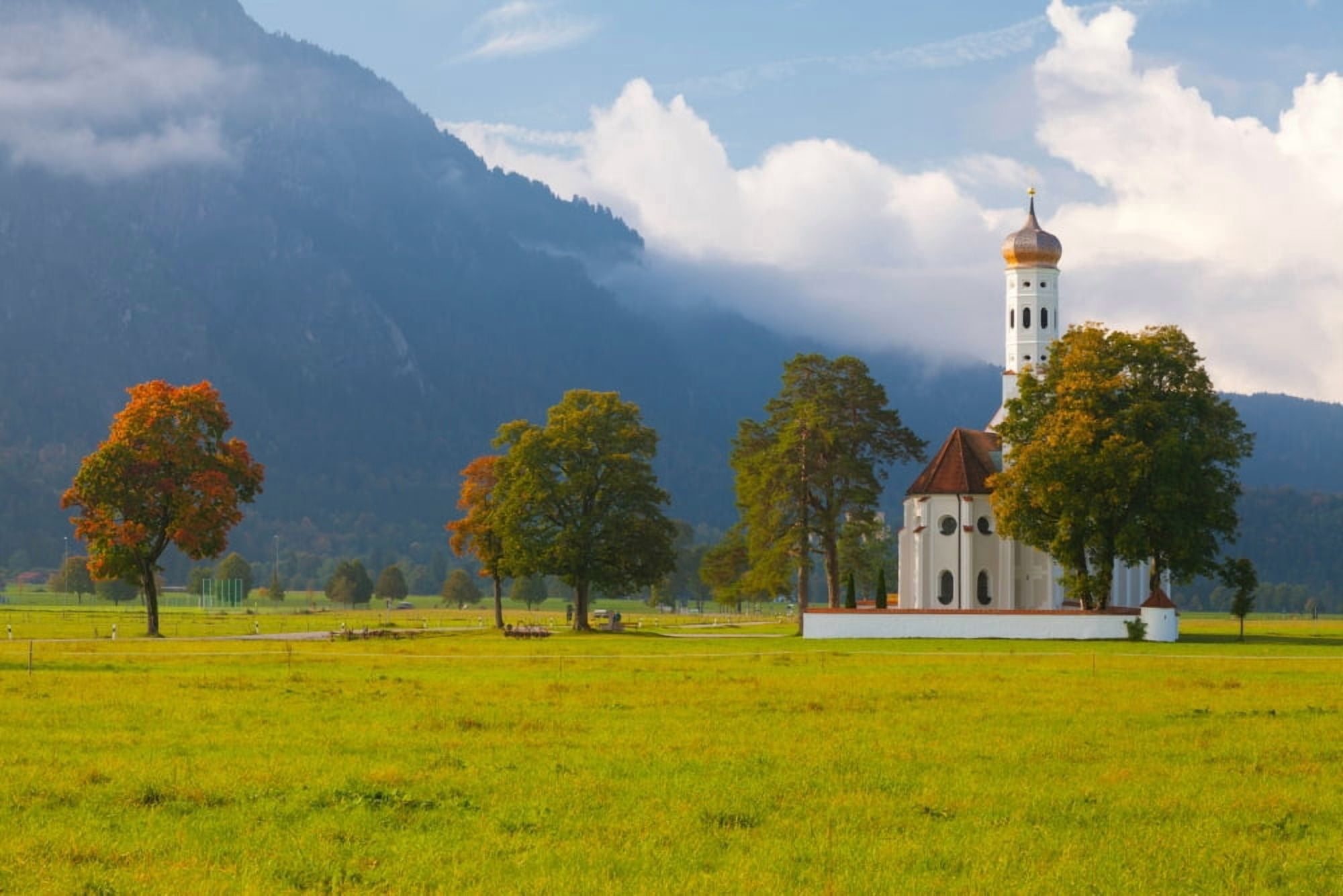 Church with a castle in the background St Coloman Church Neuschwanstein Castle Fussen Allgau Bavaria Germany Canvas Art - Panoramic Images (27 x 9)