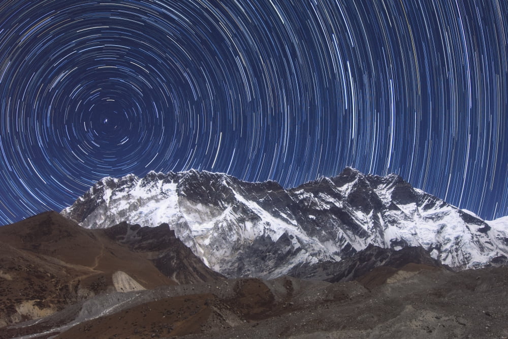 Circumpolar star trails above Lhotse mountain in Sagarmatha National Park Nepal Canvas Art - Jeff DaiStocktrek Images (17 x 12)