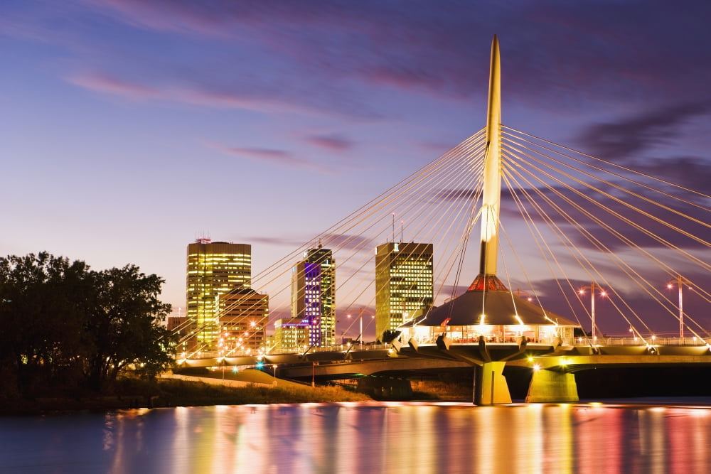 City Skyline Red River And Provencher Bridge At Dusk Winnipeg Manitoba Canvas Art - Yves Marcoux Design Pics (17 x 11)