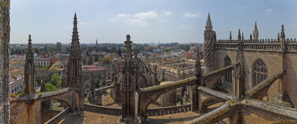 City view from a cathedral roof Seville Cathedral Seville Andalusia Spain Canvas Art - Panoramic Images (27 x 9)