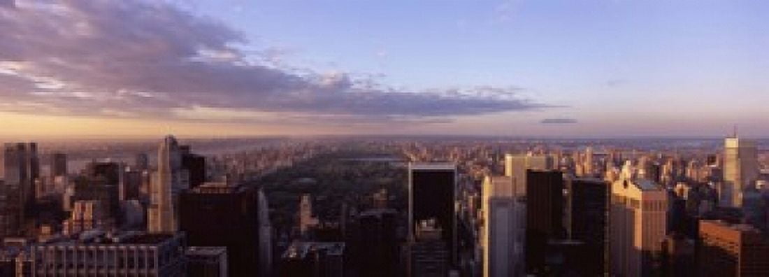 Cityscape at sunset Central Park East Side of Manhattan New York City New York State USA 2009 Canvas Art - Panoramic Images (18 x 7)