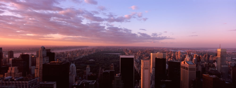 Cityscape at sunset Central Park East Side of Manhattan New York City New York State USA Canvas Art - Panoramic Images (27 x 9)