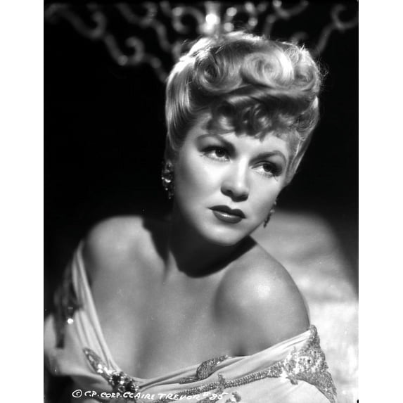 Claire Trevor Looking Away in Floral Dress with Earrings Photo Print (24 x 30)