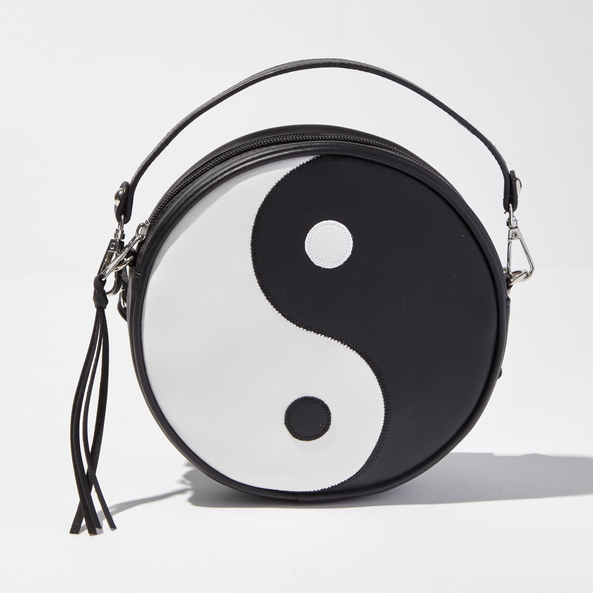 Claire s Tween Girls Black and White Ying Yang Zipper Crossbody Bag with Tassel