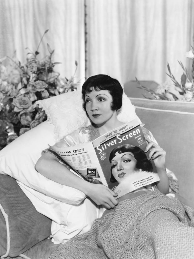 Claudette Colbert With Copy Of Silver Screen Magazine Which Has Her On The Cover Canvas Art - (16 x 20)