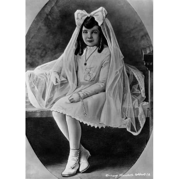 Claudette Colbert sitting on Bed, wearing White Dress with Veil Photo Print (8 x 10)