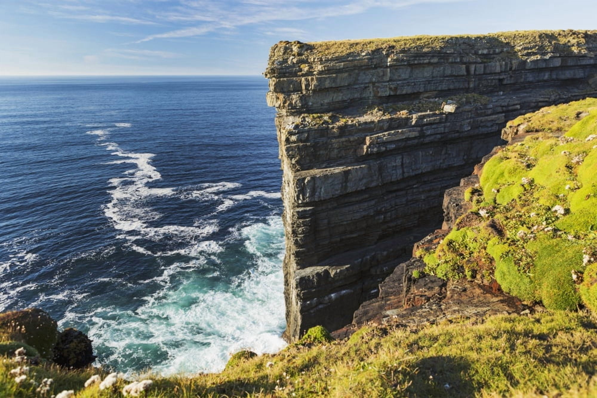 Cliff face rock formation in ocean with waves blue sky and clouds Kilkee County Clare Ireland Canvas Art - Michael Interisano Design Pics (19 x 12)