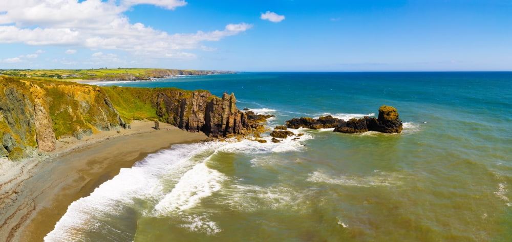 Cliffs on the beach Trawnamoe Beach Copper Coast Geopark Bunmahon County Waterford Republic of Ireland Canvas Art - Panoramic Images (36 x 12)
