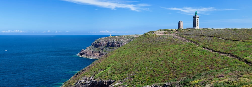 Cliffs with two lighthouses at the coast Cap Frehel Cotes-dArmor Brittany France Canvas Art - Panoramic Images (27 x 9)