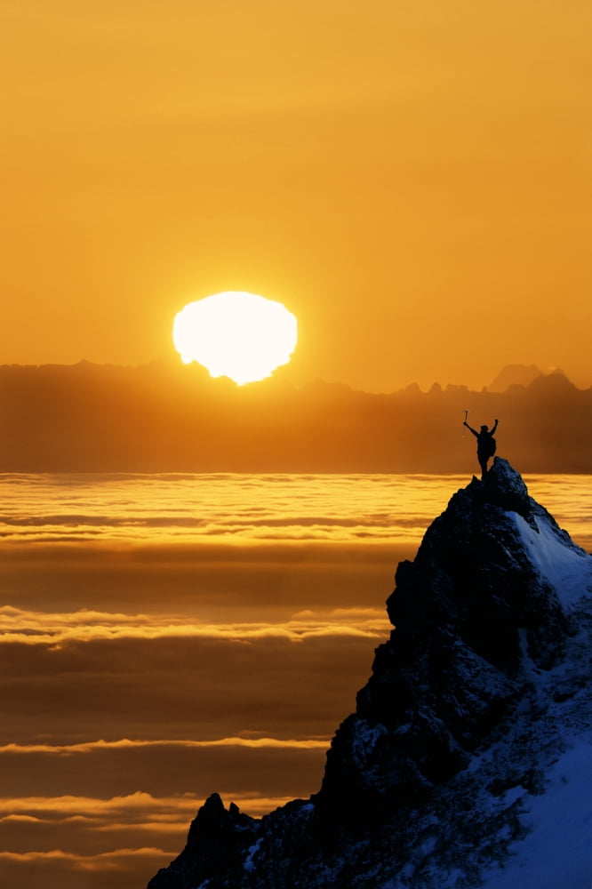 Climber Standing Atop Peak At Sunset Ak Composite Canvas Art - Michael DeYoung Design Pics (24 x 38)