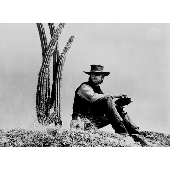 Clint Eastwood sitting in Front of Cactus, wearing Cowboy Outfit Photo Print (8 x 10)