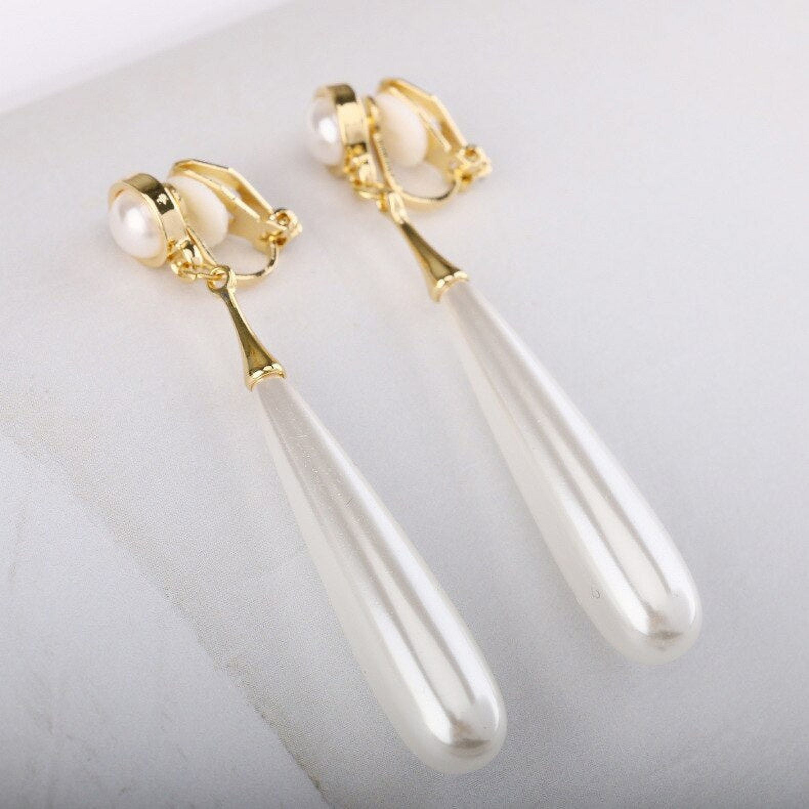 HIP AND COOL CLIP Clip on 2 1/2" gold and white long pearl earrings