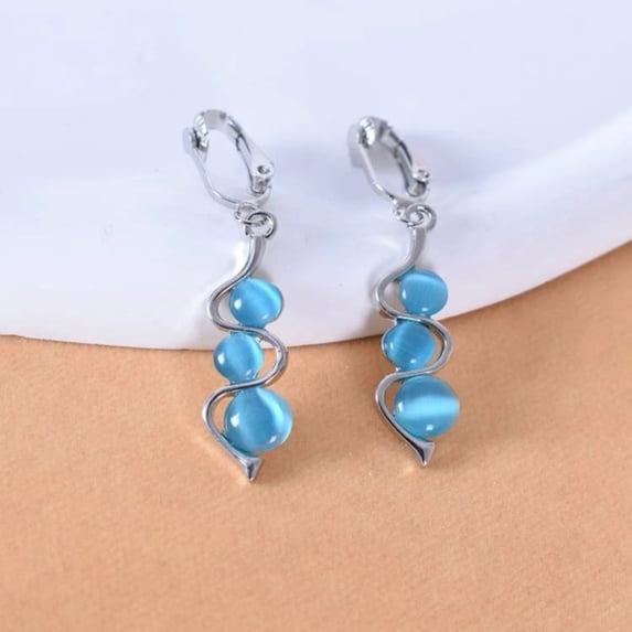 Clip on 2 1/4" silver and blue three bead dangle earrings