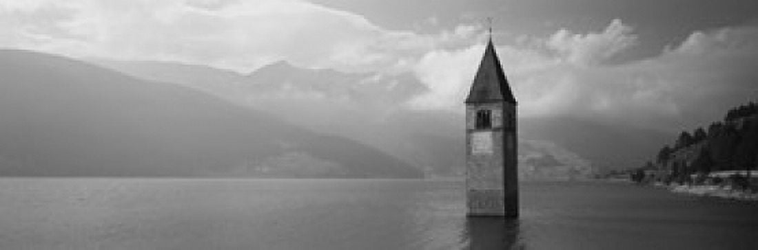 Clock tower in a lake Reschensee Italy Canvas Art - Panoramic Images (18 x 6)