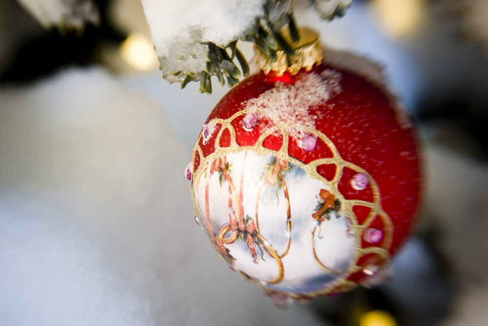 Close Up Of A Christmas Ornament Hanging On A Snowcovered Branch Outdoors During Winter Canvas Art - Kevin Smith Design Pics (17 x 11)