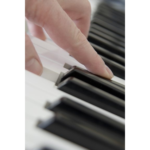 Close Up Of Finger Playing Piano Keyboard Canvas Art - John Short Design Pics (22 x 34)