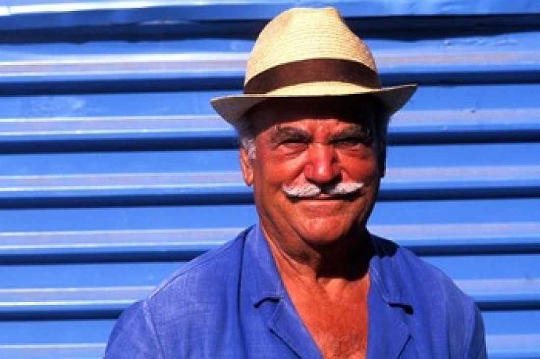 Close Up of Native Man with Blue Wall Athens Greece Canvas Art - Bill Bachmann DanitaDelimont (18 x 12)