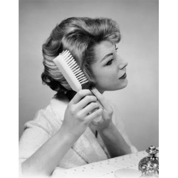 Close-Up of a Young Woman Brushing Her Hair Poster Print - 18 x 24 in.