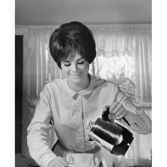 Close-Up of a Young Woman Pouring Coffee Into a Cup From a Coffee Pot Poster Print - 18 x 24 in.