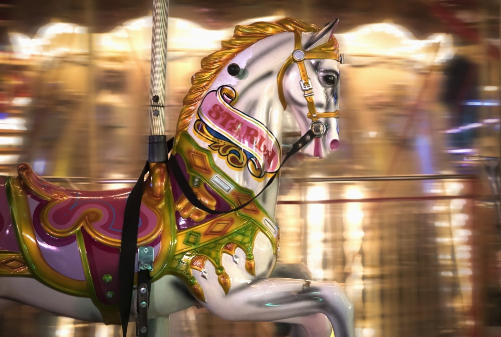 Close up of a painted horse on a carousel with blurred lights in the background Sunderland Tyne and Wear England Canvas Art - John Short Design Pics (36 x 24)