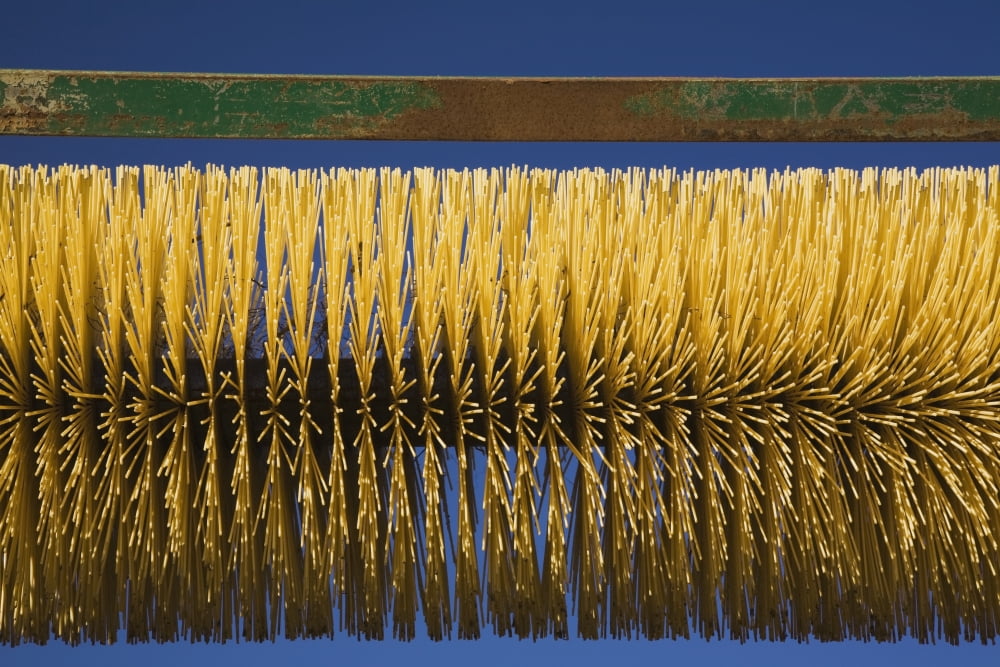 Close-up of a mechanized circular brush on a piece of heavy equipment used in a commercial sandpitQuebec canada Canvas Art - Perry Mastrovito Design Pics (19 x 12)