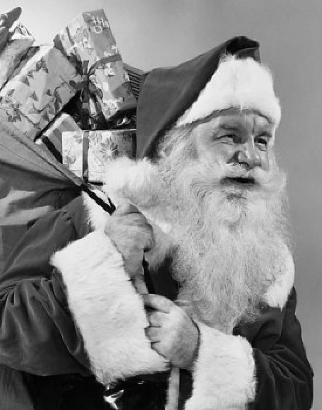 Close-up of Santa Claus carrying a sack of Christmas presents on his back Canvas Art - (18 x 24)