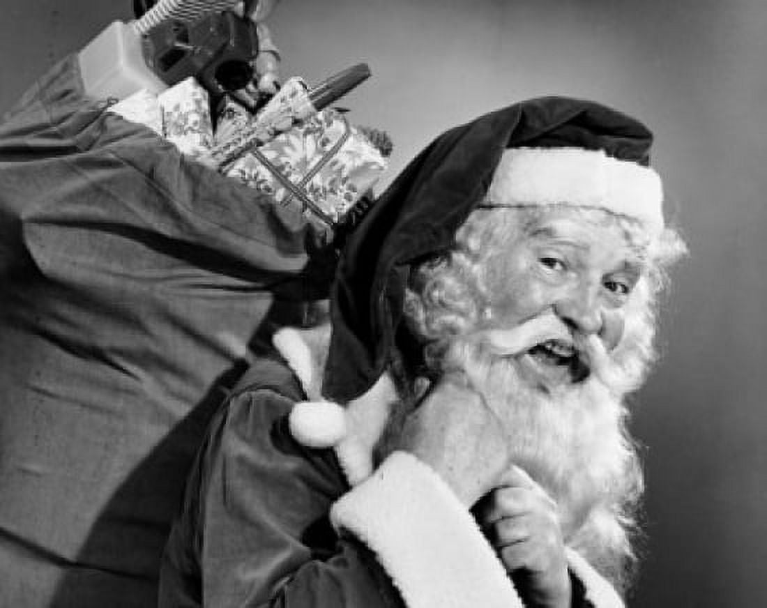Close-up of Santa Claus carrying a sack of gifts on his back Canvas Art - (24 x 36)