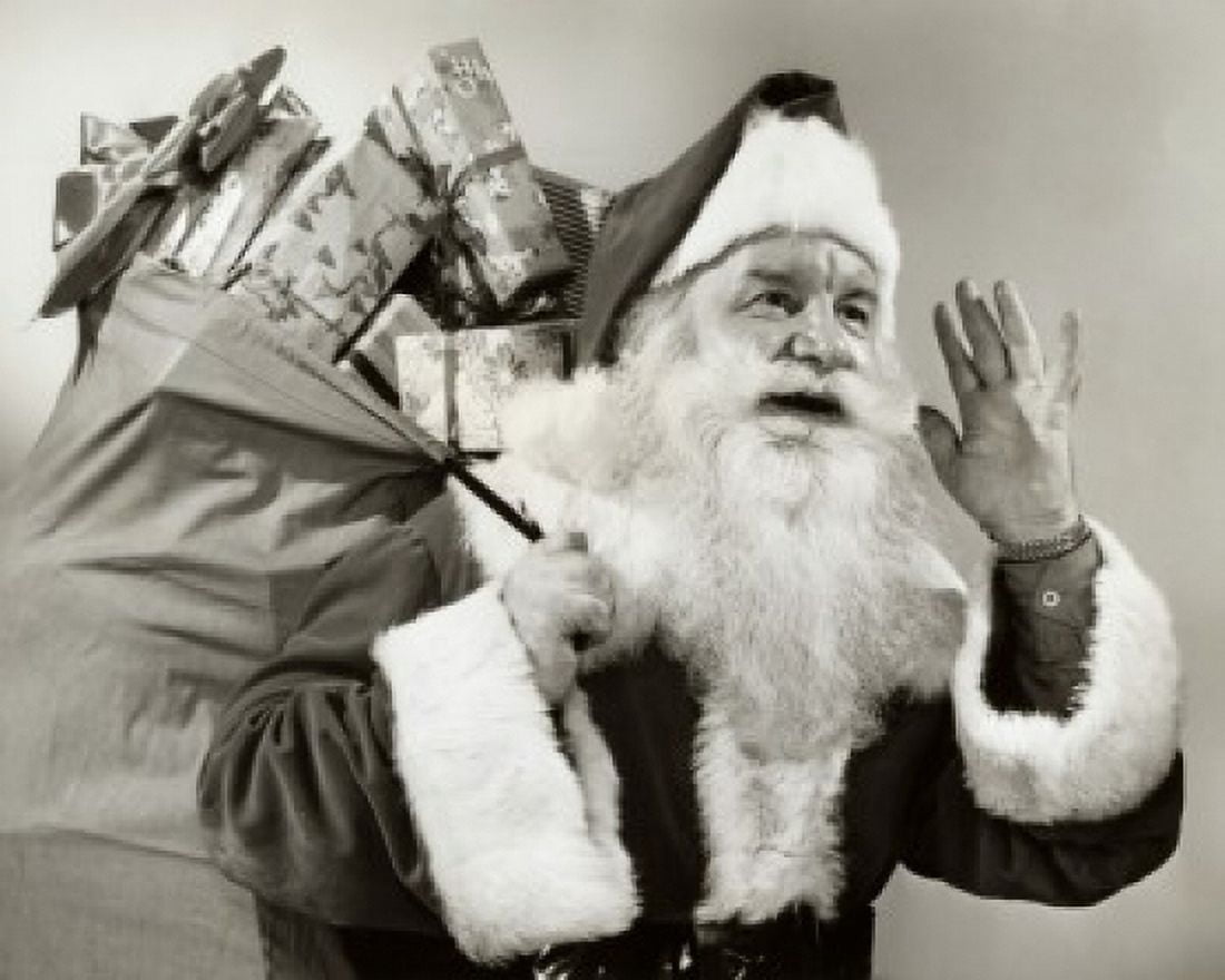 Close-up of Santa Claus carrying a sack of gifts on his back Canvas Art - (24 x 36)