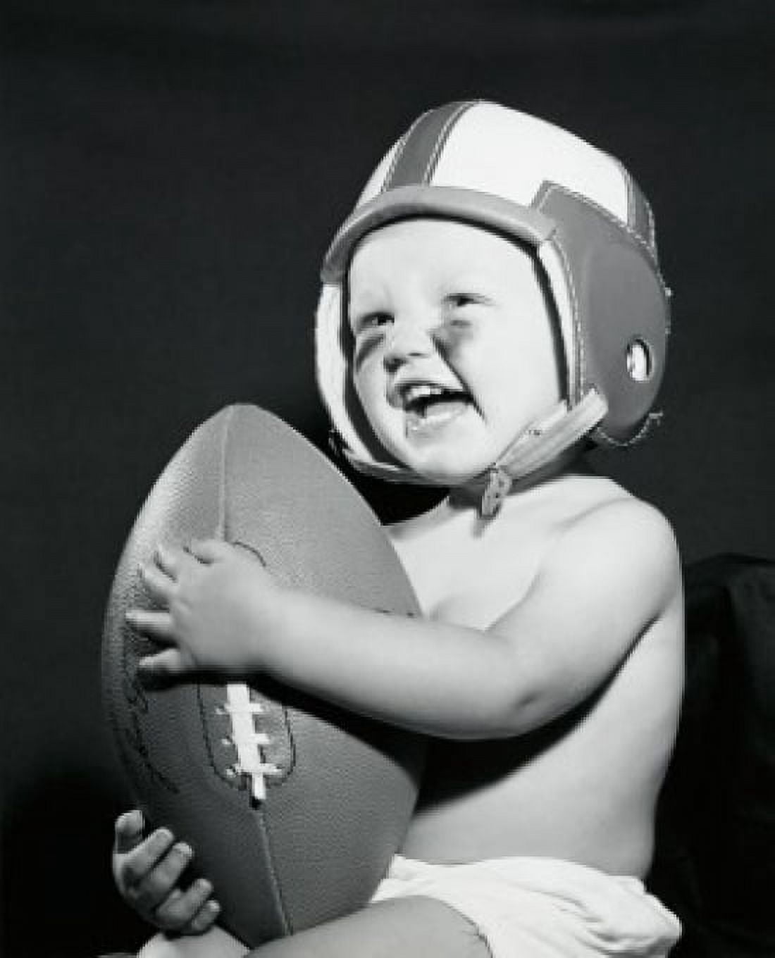 Close-up of a baby boy holding a football Canvas Art - (18 x 24)