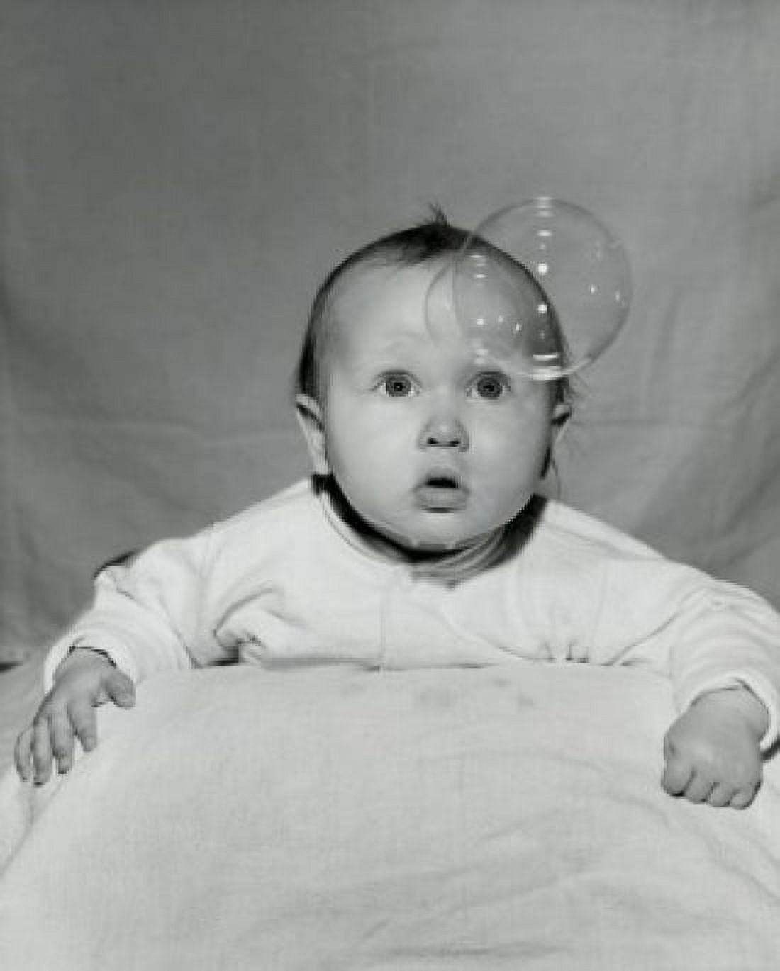 Close-up of a baby boy looking at a bubble Canvas Art - (18 x 24)