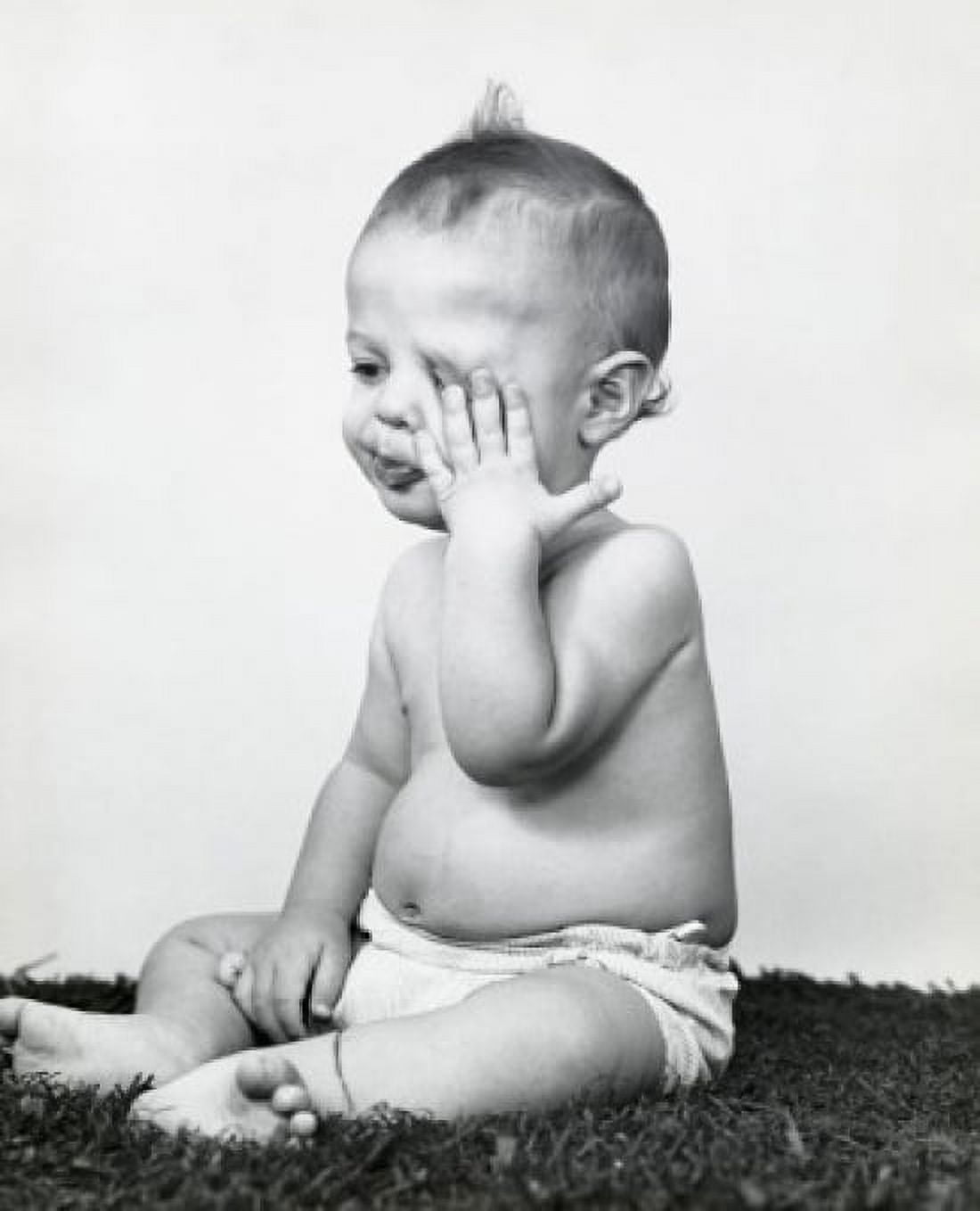Close-up of a baby boy rubbing his eye Canvas Art - (24 x 36)