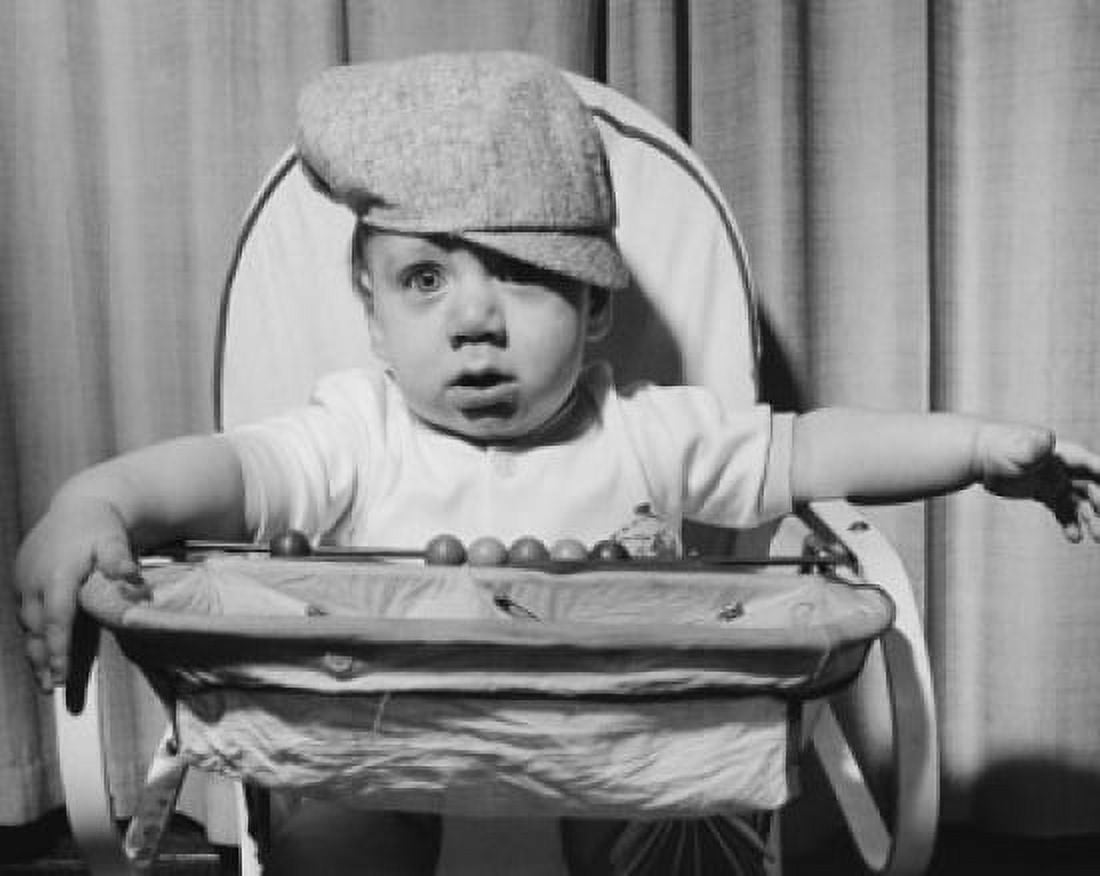 Close-up of a baby boy sitting in a high chair Canvas Art - (24 x 36)