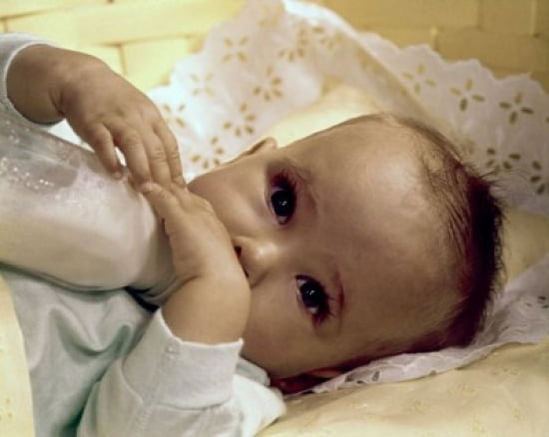Close-up of a baby drinking milk from a baby bottle Canvas Art - (24 x 36)