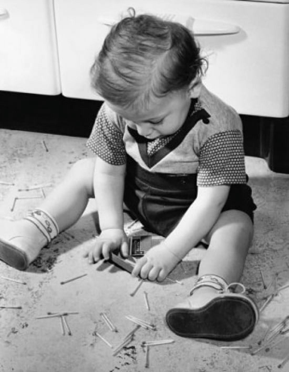 Close-up of a baby playing with matchsticks Canvas Art - (24 x 36)