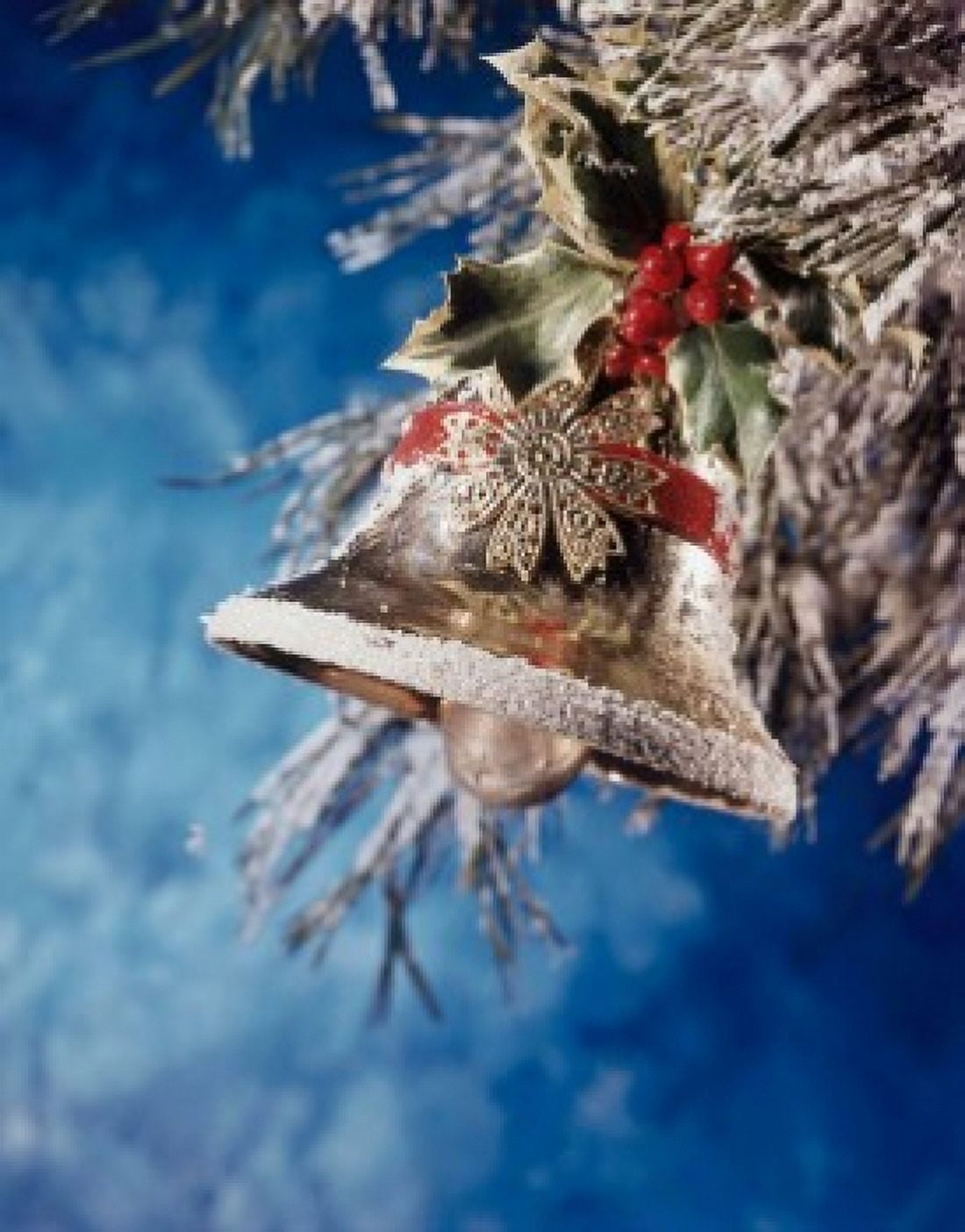 Close-up of a bell with holly leaves and berries hanging on a Christmas tree Canvas Art - (18 x 24)
