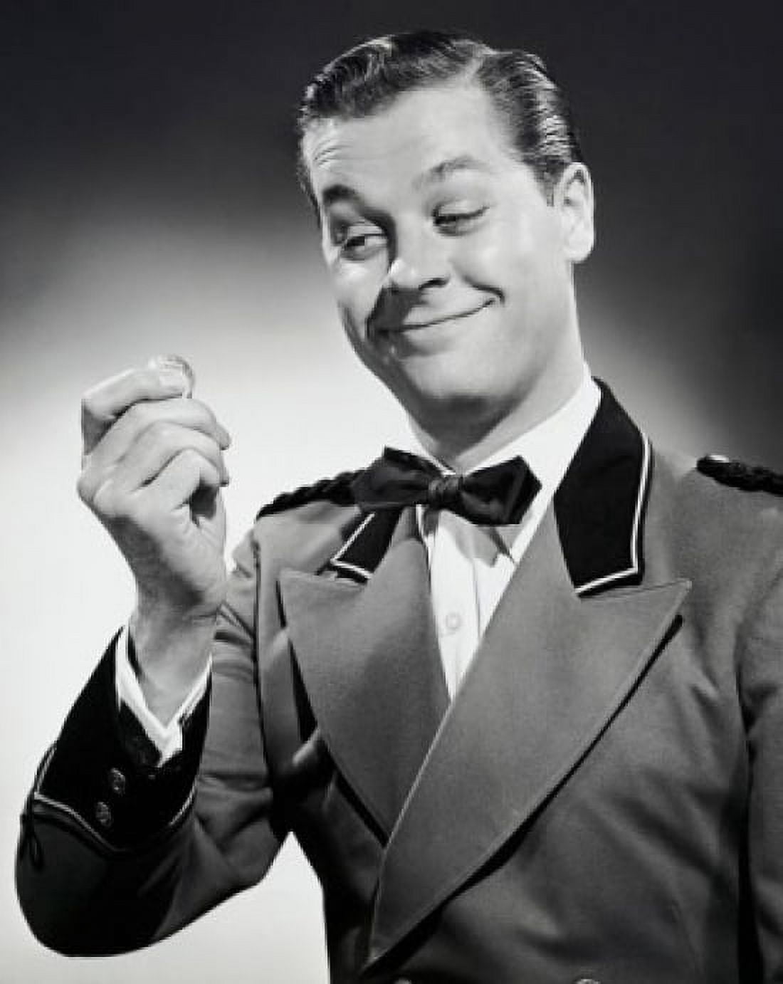 Close-up of a bellhop smiling and holding a coin Canvas Art - (18 x 24)