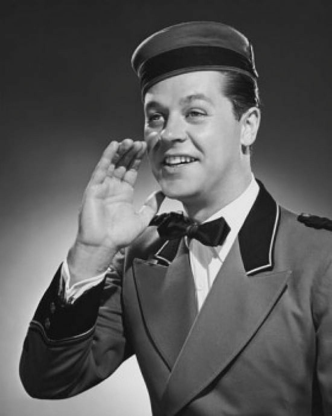 Close-up of a bellhop talking with his hand near his mouth Canvas Art - (18 x 24)