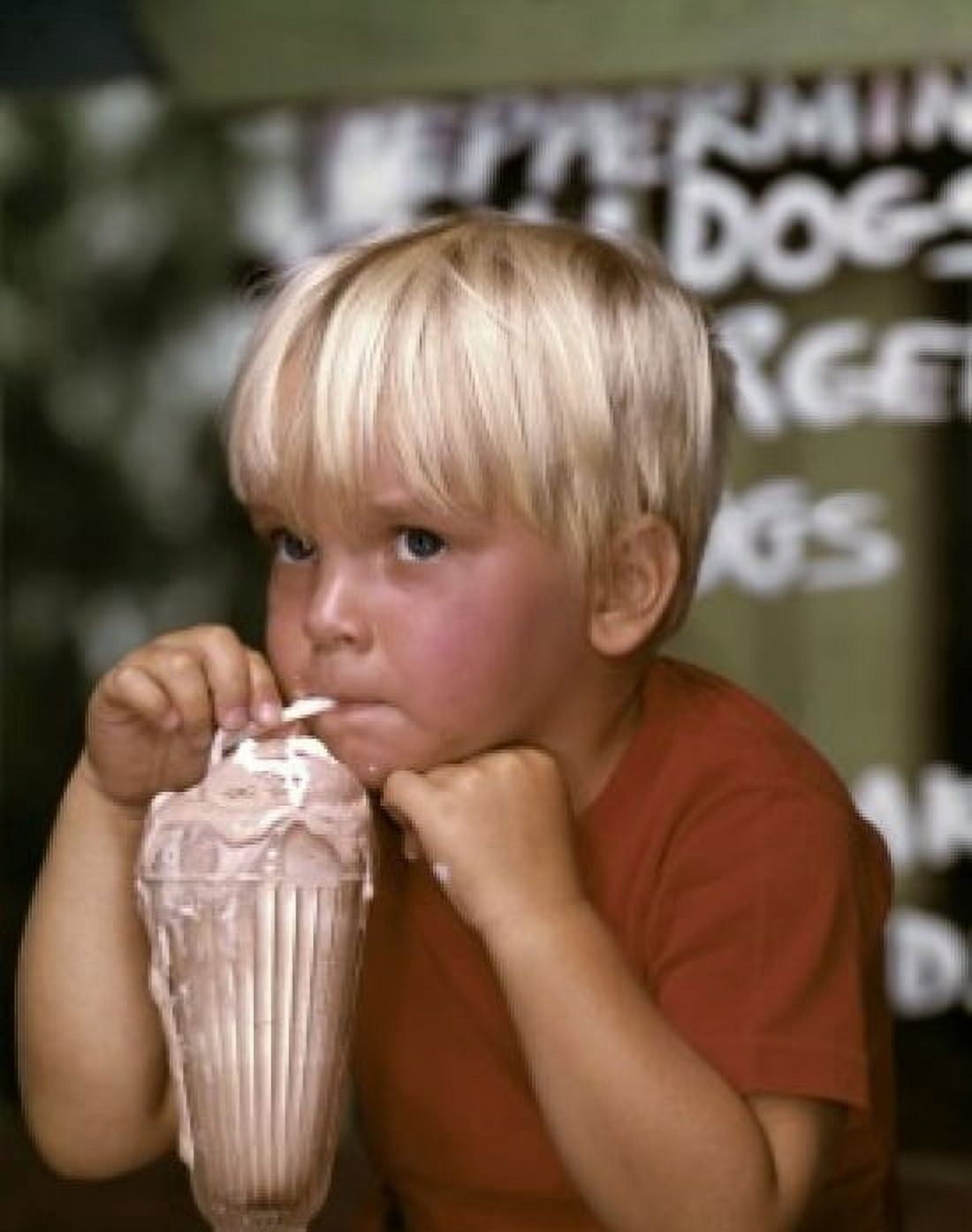 Close-up of a boy drinking milkshake and thinking Canvas Art - (24 x 36)