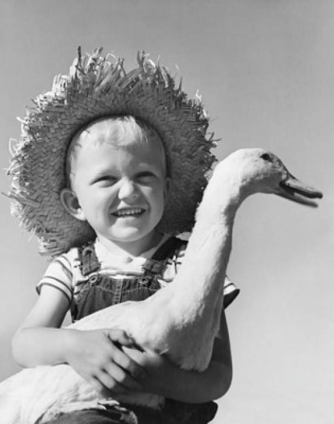 Close-up of a boy holding a duck and smiling Canvas Art - (18 x 24)