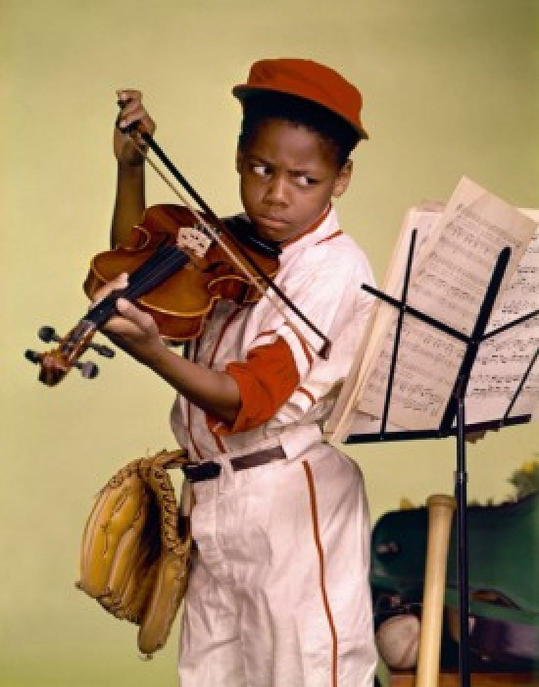 Close-up of a boy looking at a musical stand and playing a violin Canvas Art - (24 x 36)