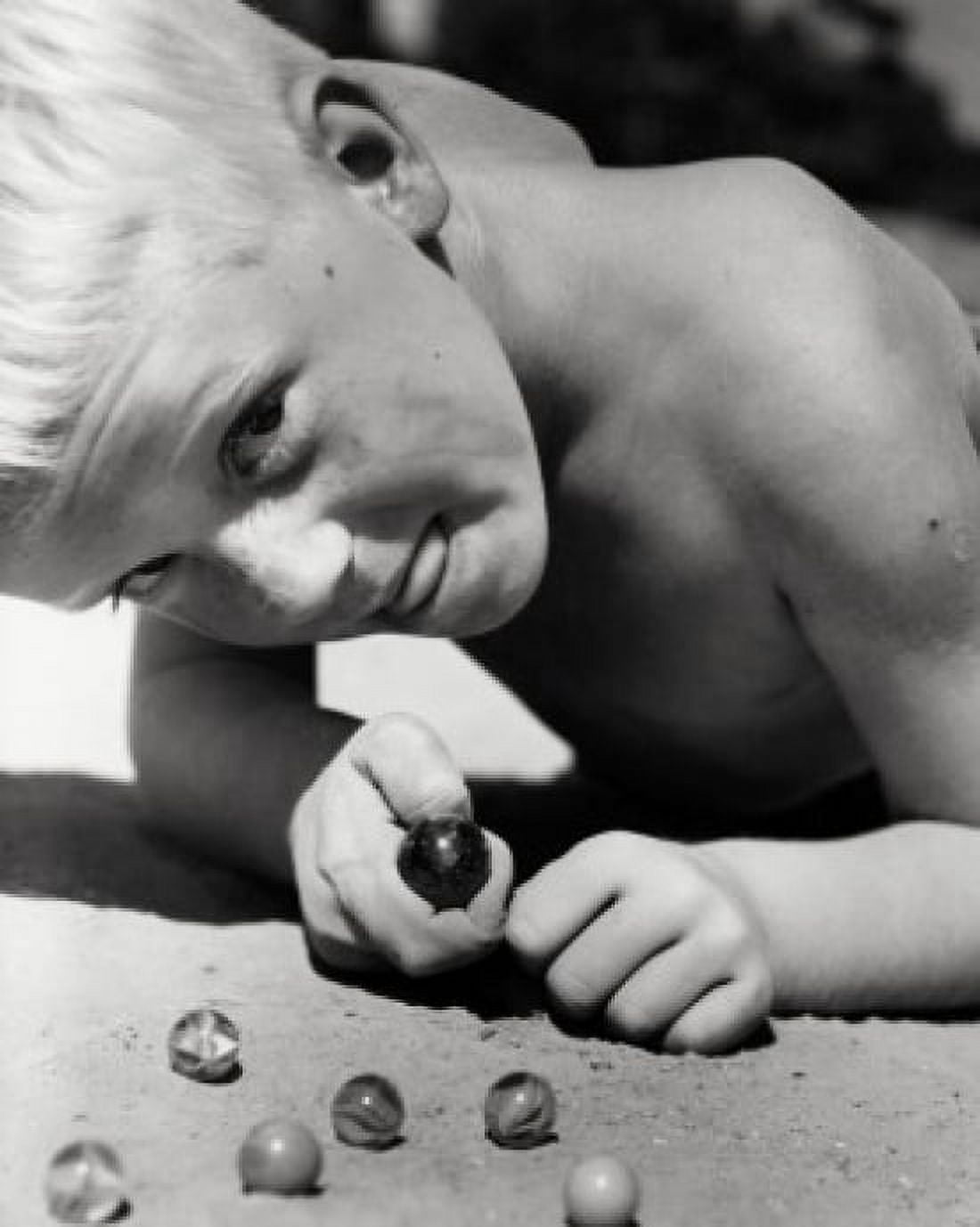 Close-up of a boy playing marbles Canvas Art - (24 x 36)