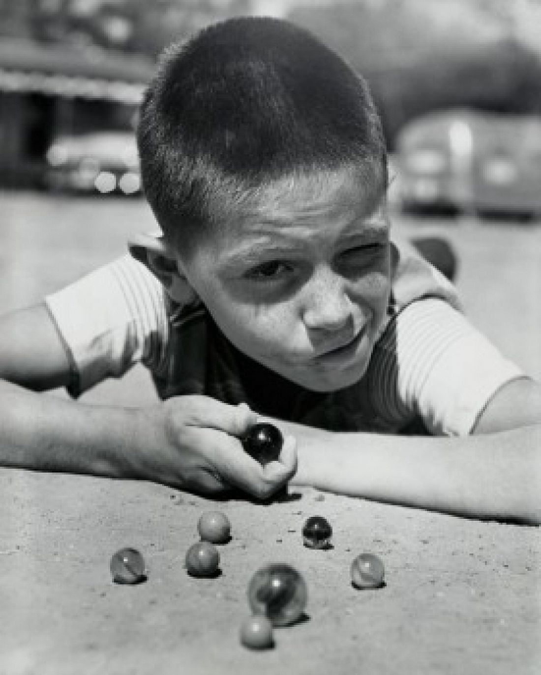 Close-up of a boy playing marbles Canvas Art - (24 x 36)