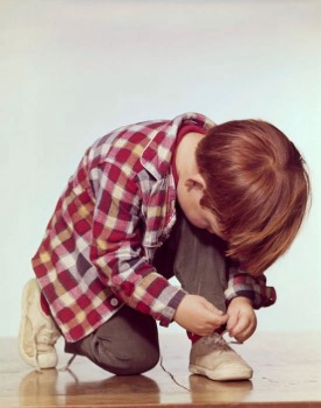 Close-up of a boy tying his shoelaces Canvas Art - (18 x 24)