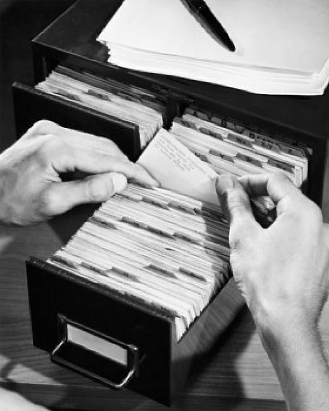 Close-up of a business person searching for files in a filing cabinet Canvas Art - (18 x 24)