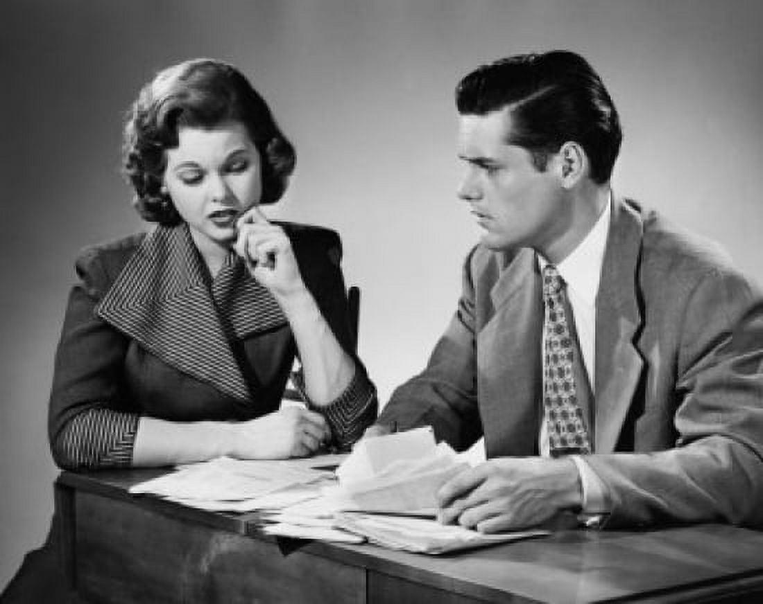 Close-up of a businessman discussing with a young woman Canvas Art -  (18 x 24)