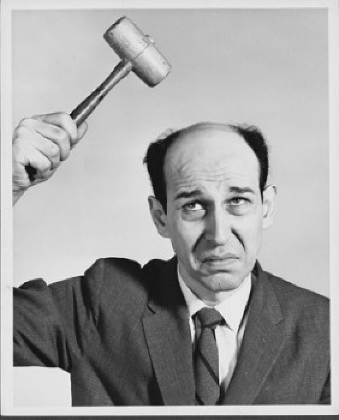 Close-up of a businessman hitting his head with a hammer Canvas Art - (18 x 24)